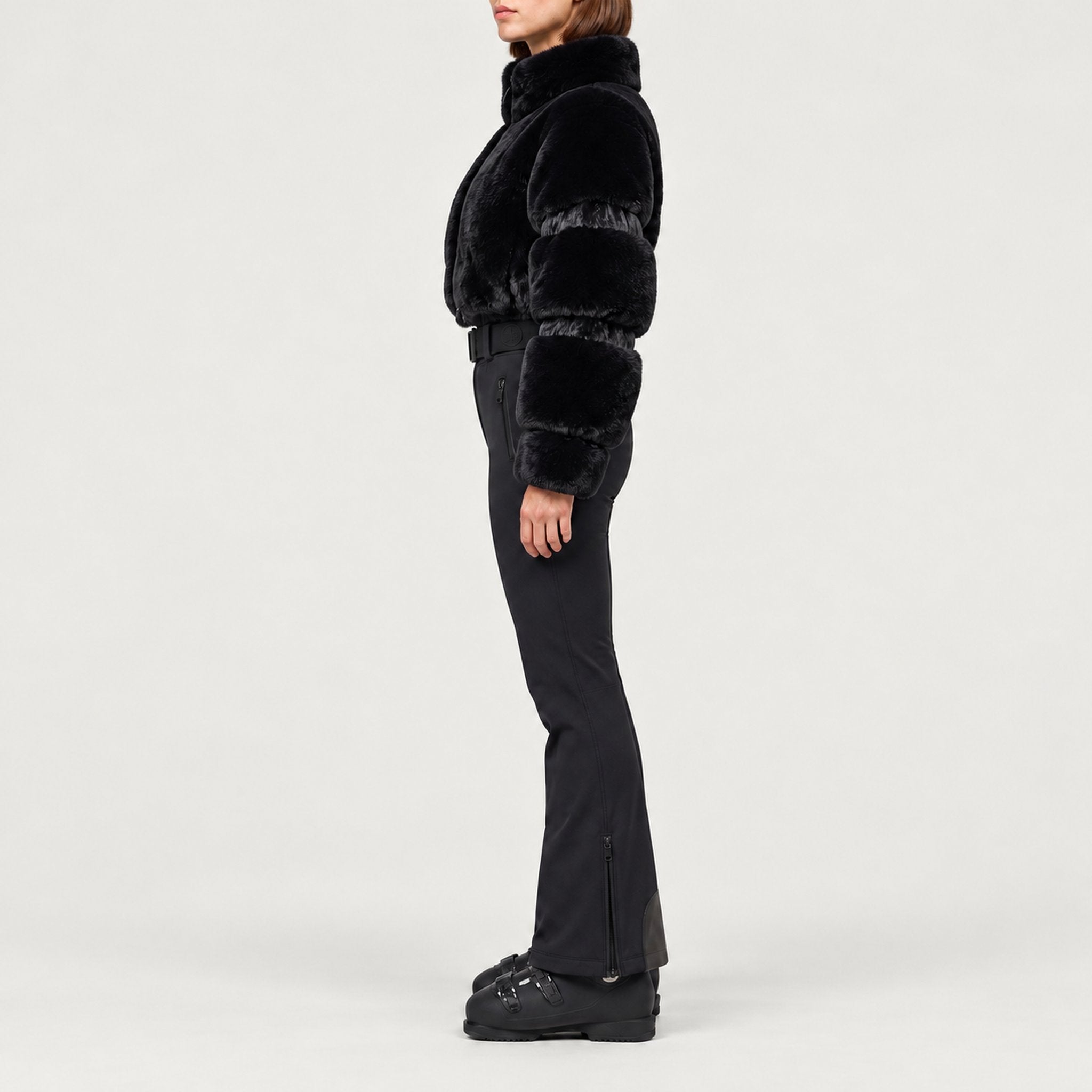 Goldbergh womens Lieke Ski Suit (Black) - model side. AI-generated from manufacturer imagery.
