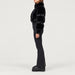 Goldbergh womens Lieke Ski Suit (Black) - model side. AI-generated from manufacturer imagery.