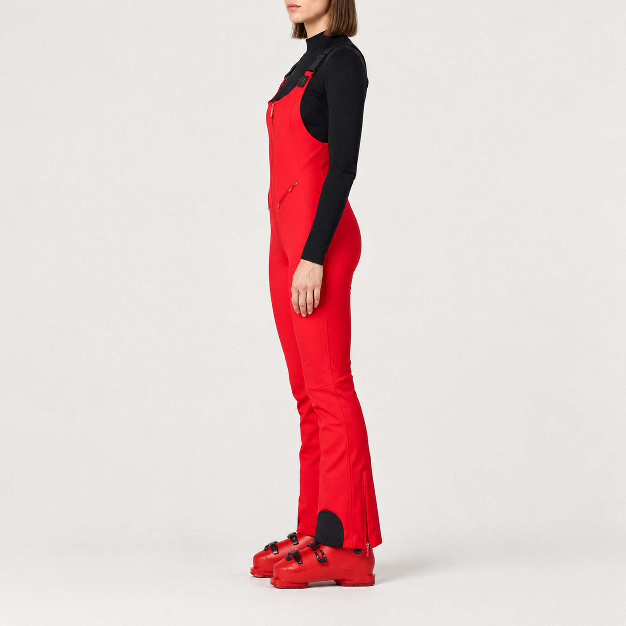 Goldbergh womens Phoebe Salopettes in Flame Red (Flame) - model side. AI-generated from manufacturer imagery.