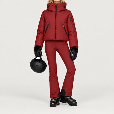 Goldbergh women's Porter Ski Jacket in Vino Rosso – ski pose view. AI-generated from manufacturer imagery.