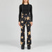 Goldbergh Sakuya Ski Pants Ski Pants in Black Gold — model front. AI-generated from manufacturer reference photographs.