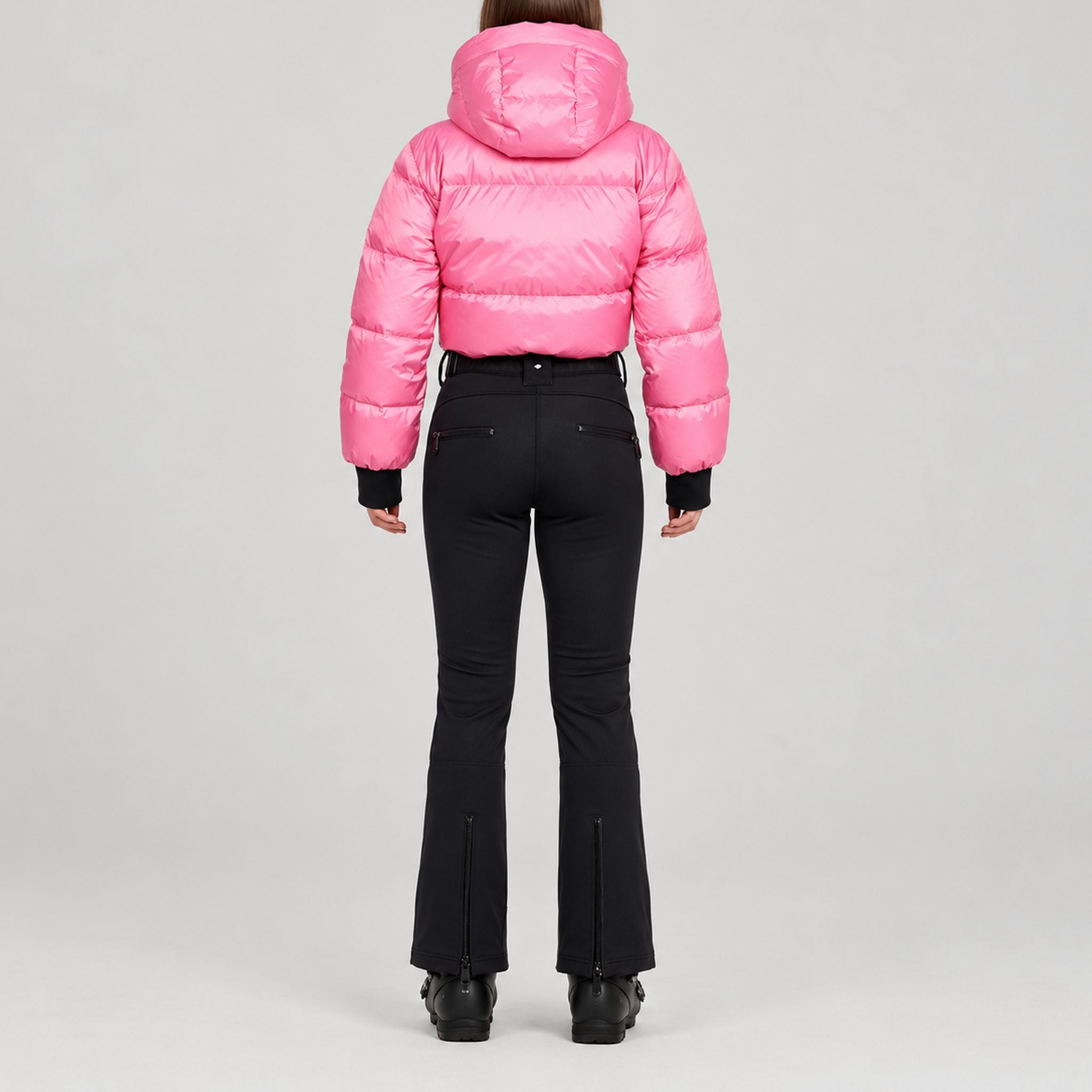 Goldbergh Sayaka Ski Suit in Pink Cosmos — model back. AI-generated from manufacturer reference photographs.