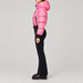 Goldbergh Sayaka Ski Suit in Pink Cosmos — model side. AI-generated from manufacturer reference photographs.