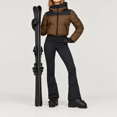 Goldbergh women's Village Ski Jacket in Army – ski pose view. AI-generated from manufacturer imagery.