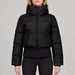 Goldbergh Village Ski Jacket in Black in Black — model front. AI-generated from manufacturer reference photographs.