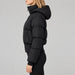 Goldbergh Village Ski Jacket in Black in Black — model side. AI-generated from manufacturer reference photographs.