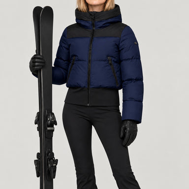 Goldbergh women's Village Ski Jacket in French Blue – ski pose view. AI-generated from manufacturer imagery.