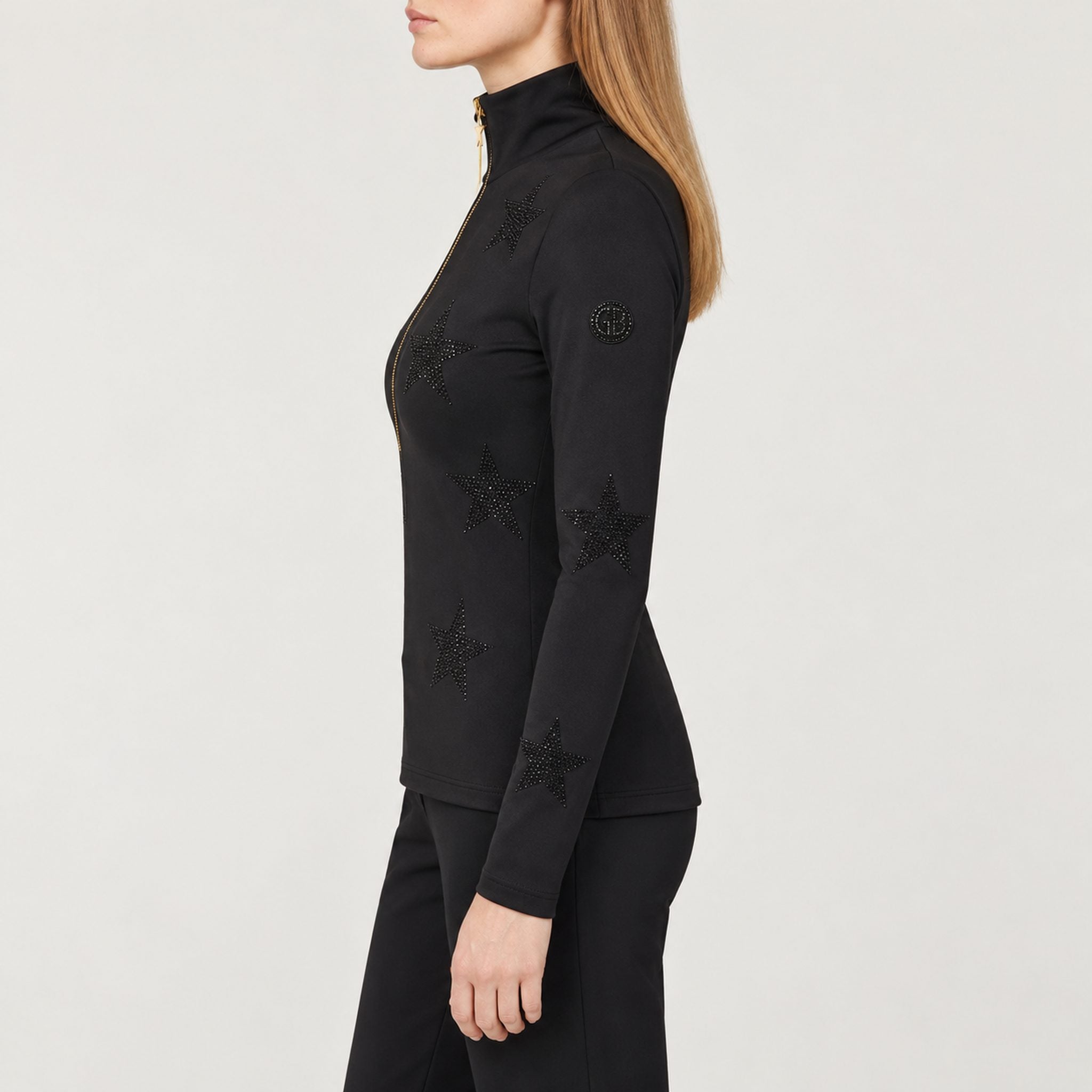 Goldbergh women's Yura Pully in Black – model side. AI-generated from manufacturer reference images.
