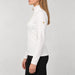 Goldbergh women's Yura Pully in Snow White – model side. AI-generated from manufacturer reference images.