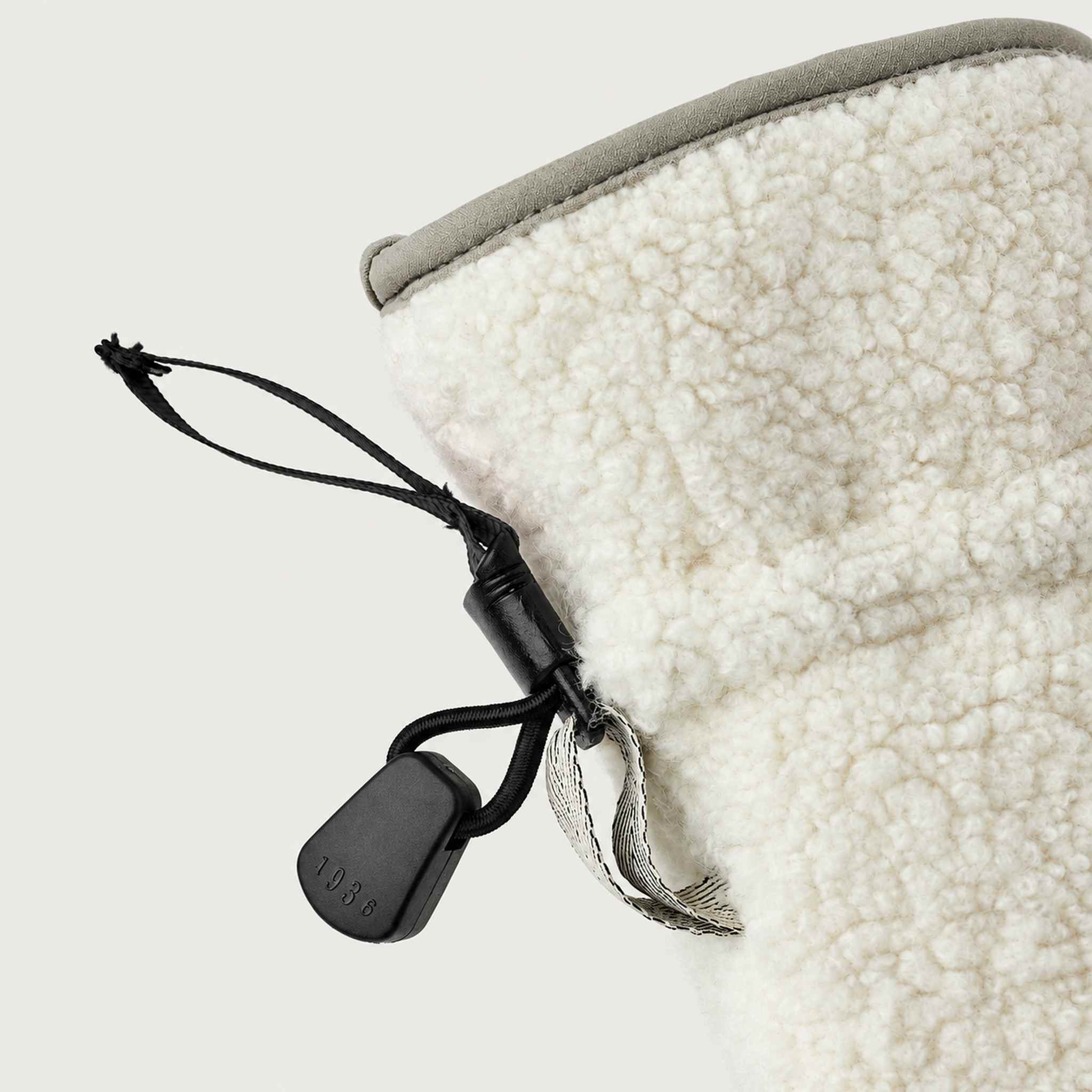Hestra unisex Alta Mitt in Off White - cuff and drawcord detail. AI-generated from Hestra product photography.