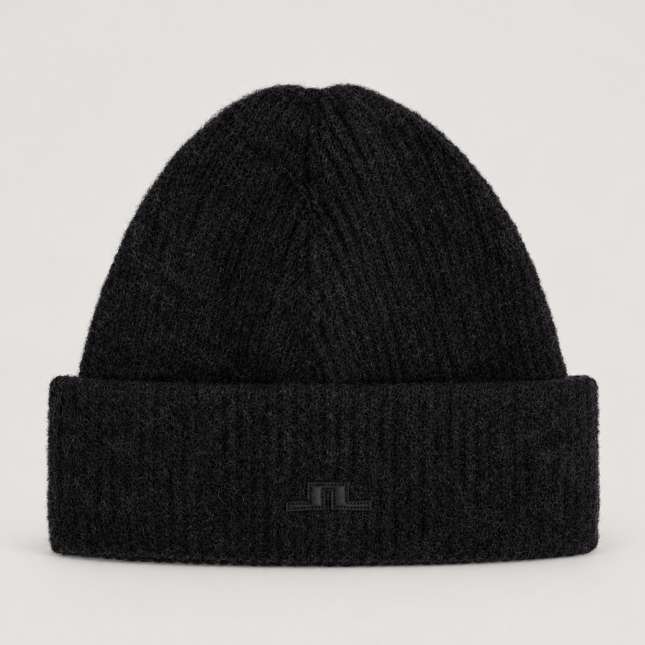 J Lindeberg Monta Beanie in Black, front view on a warm grey background