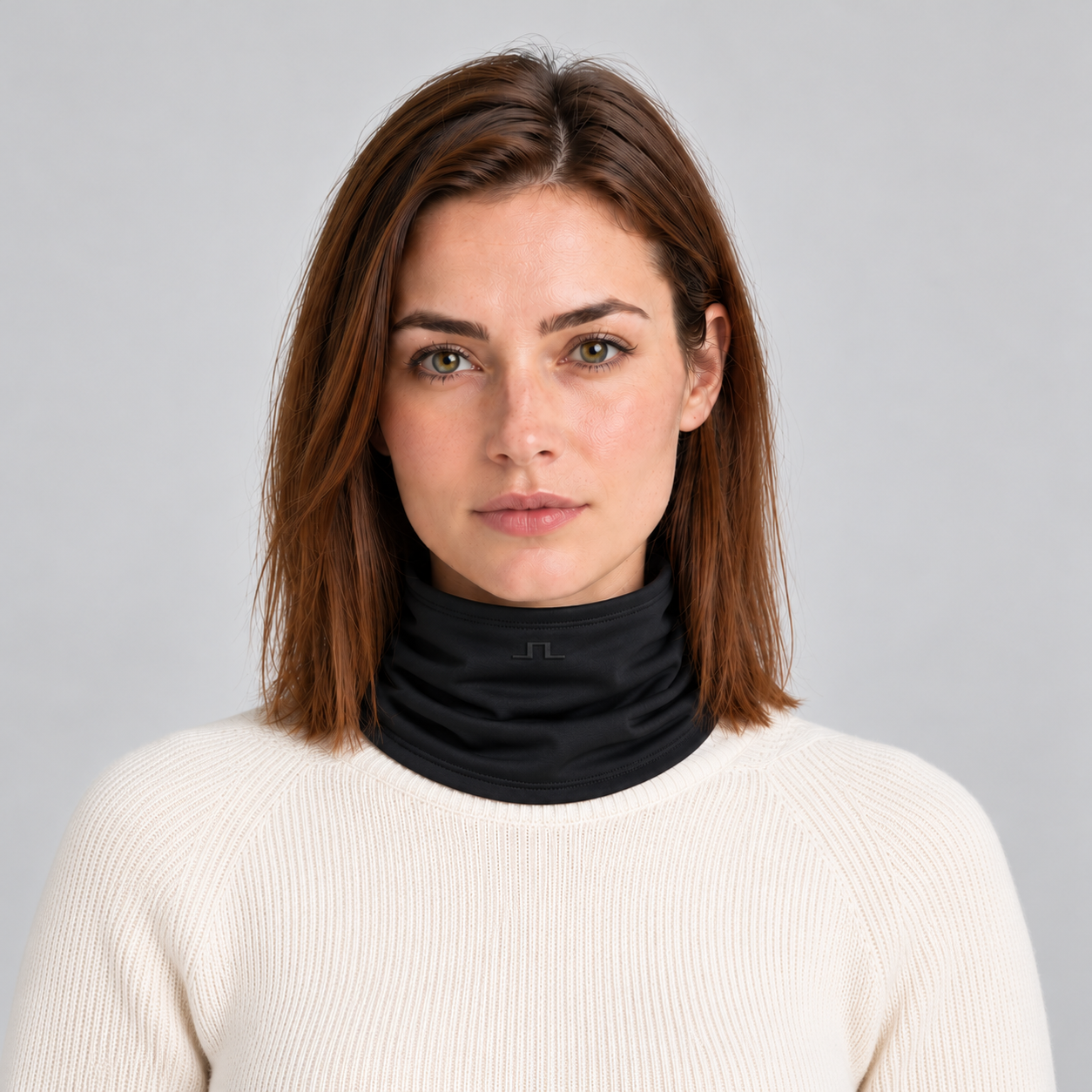 J Lindeberg Rise Neck Gaiter in Black, female front