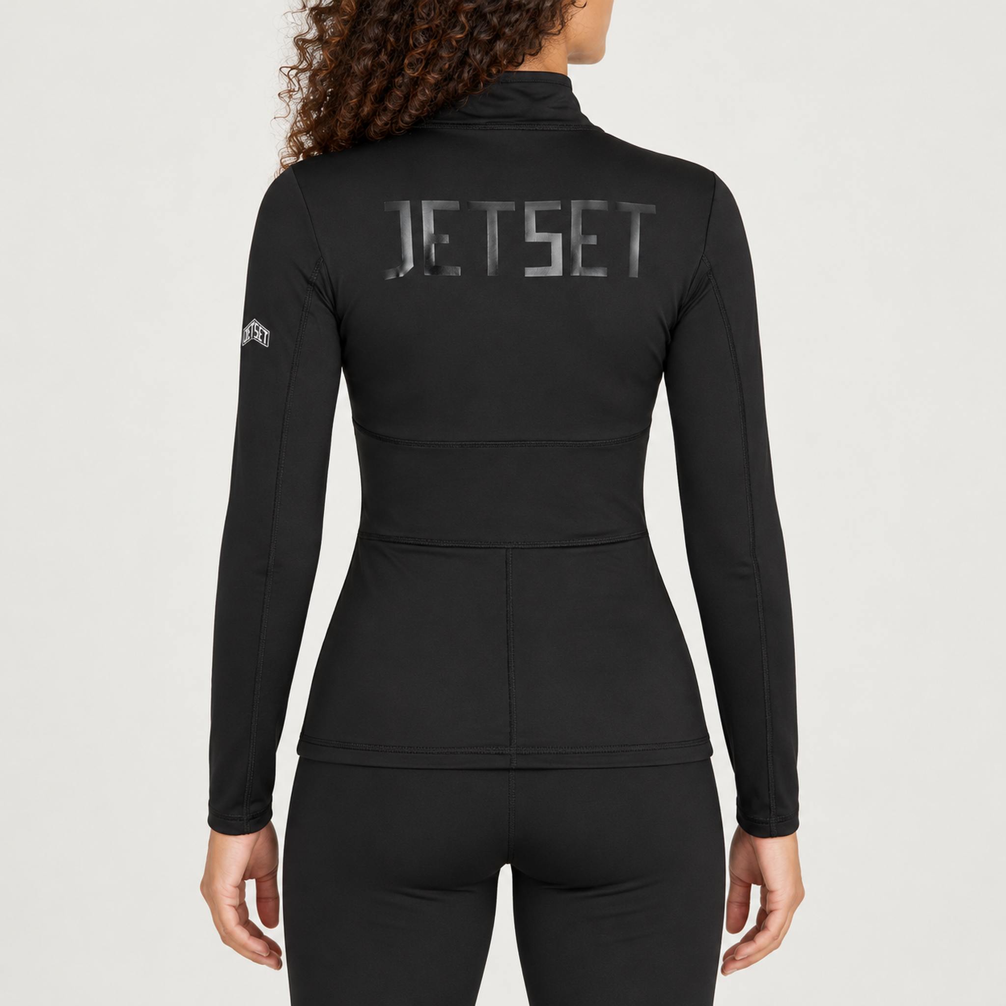Jetset women's Ginger Half Zip Baselayer in Black — model back