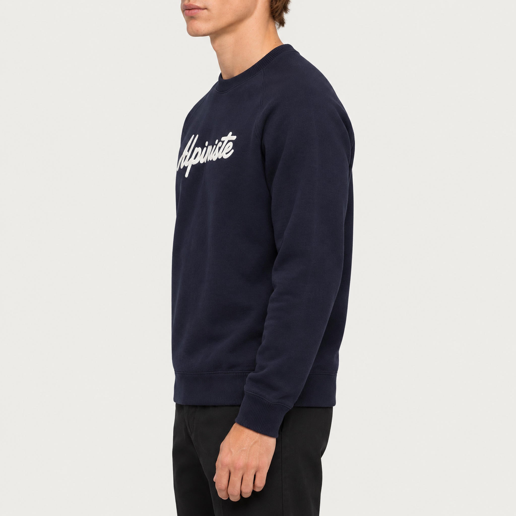 French Disorder men Alpiniste Sweater in Navy - model side | London Ski Co