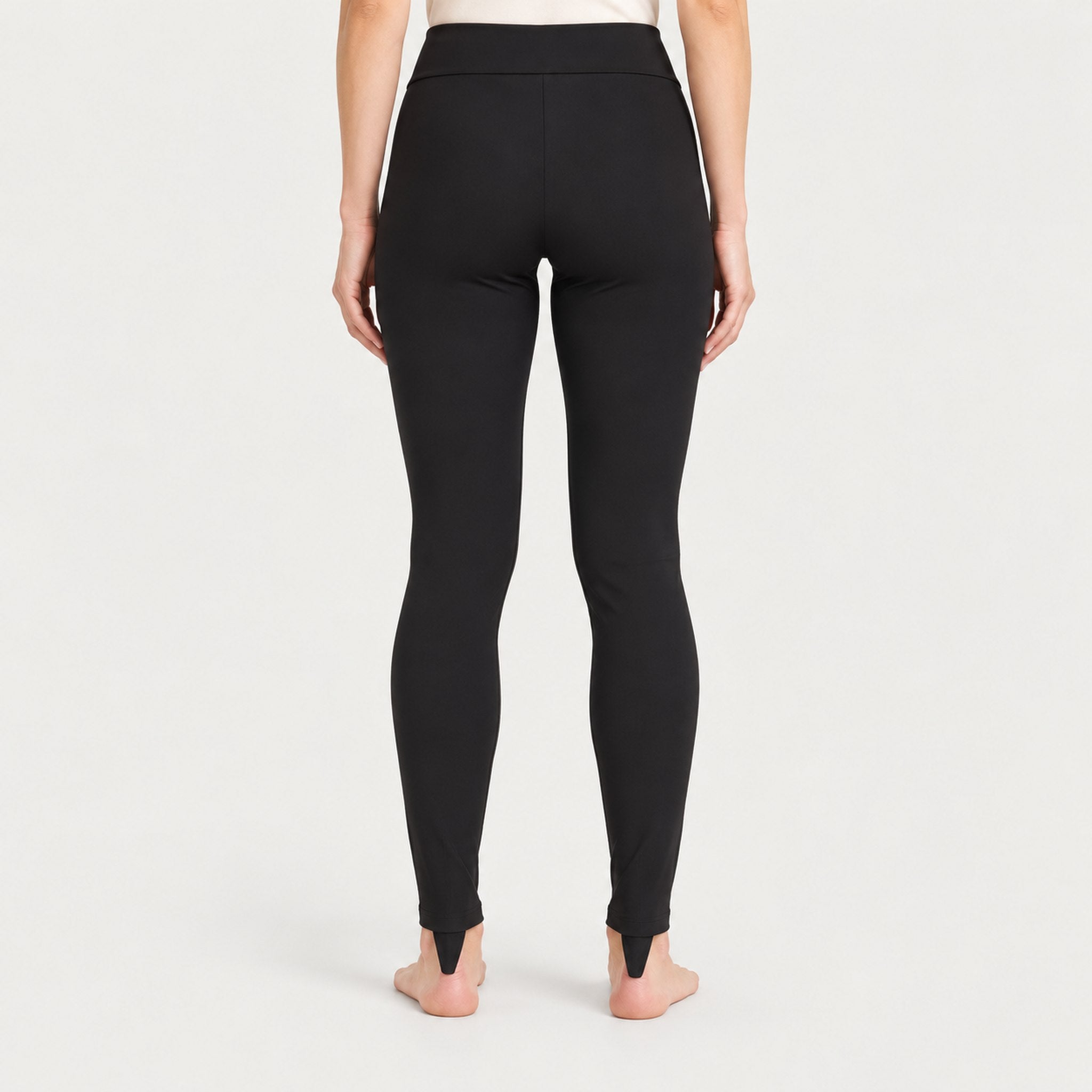 Newland womens Alpette Skinny Ski Pants in Black - model back. AI-generated from supplied artwork.