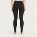 Newland womens Alpette Skinny Ski Pants in Black - model back. AI-generated from supplied artwork.
