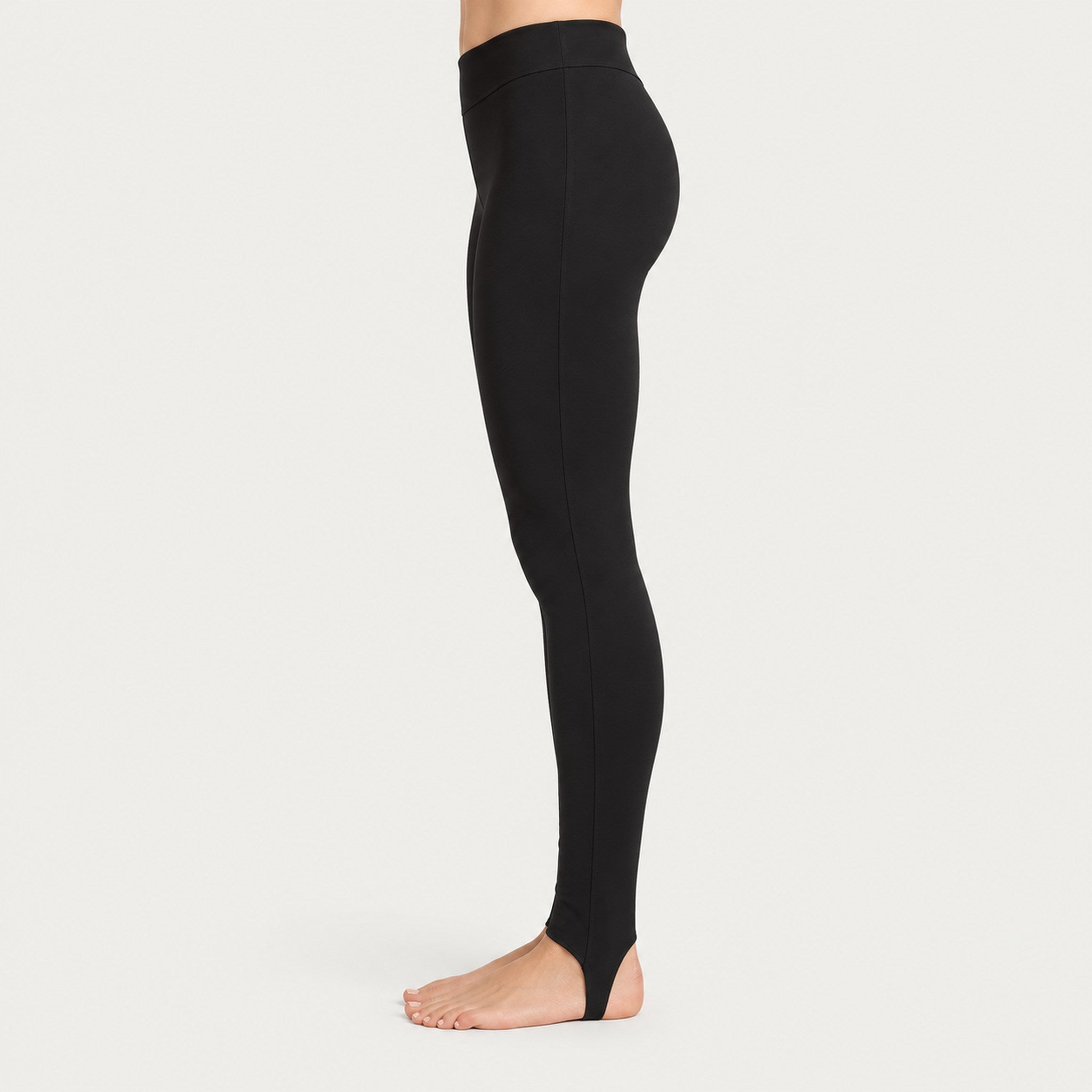 Newland womens Alpette Skinny Ski Pants in Black - model side. AI-generated from supplied artwork.
