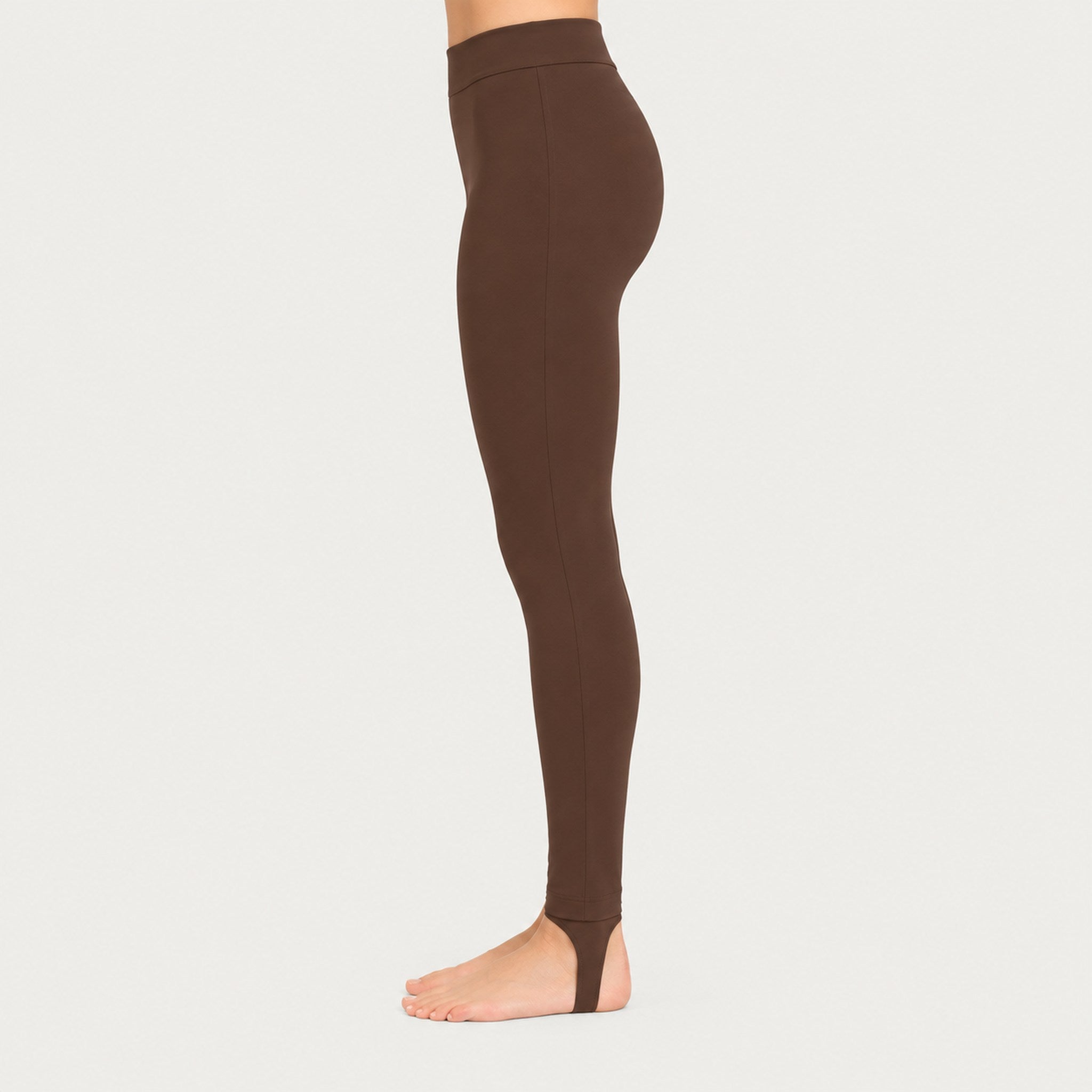 Newland womens Alpette Skinny Ski Pants in Brown - model side. AI-generated from supplied artwork.