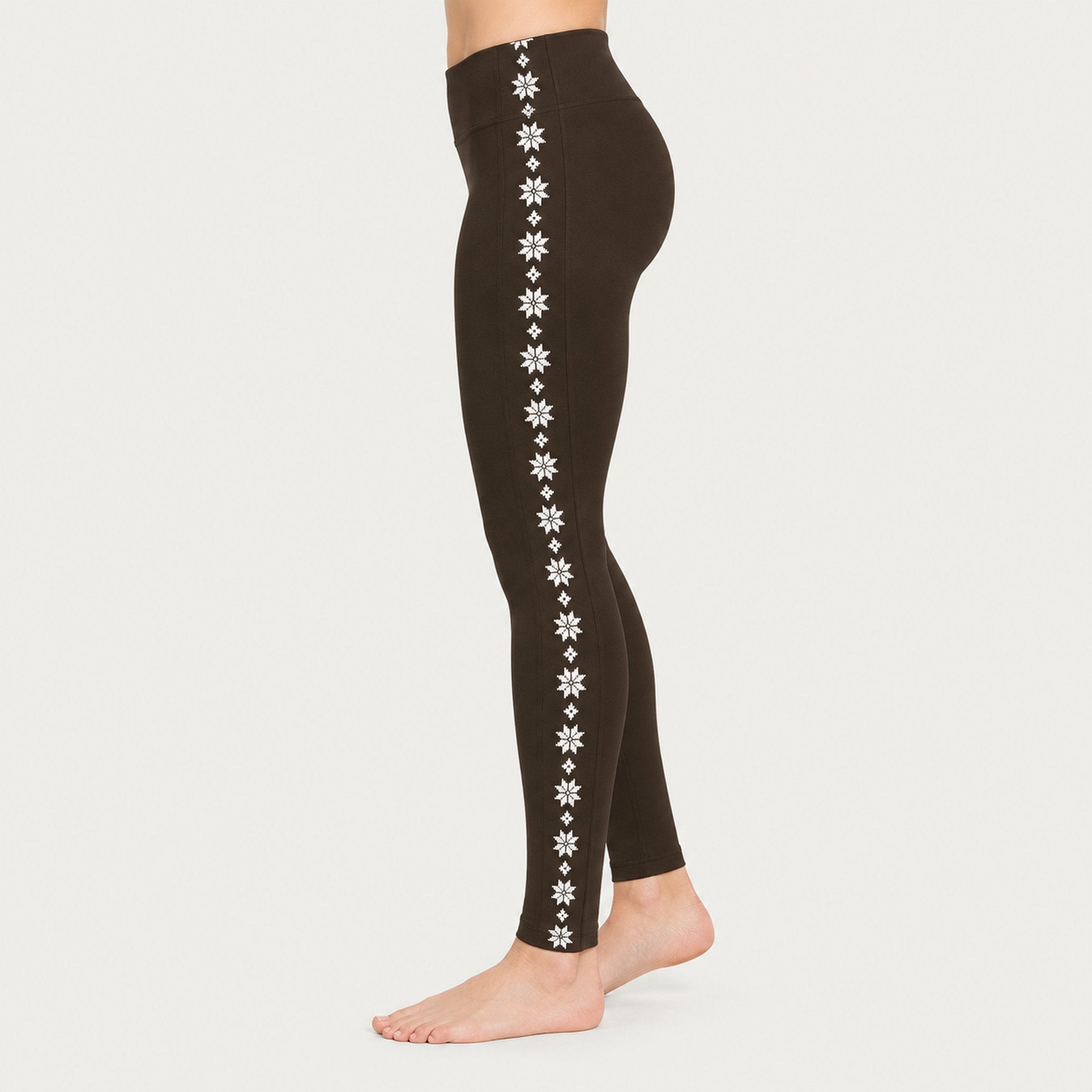 Newland womens Calith Leggings in Brown - model side. AI-generated from supplied artwork.