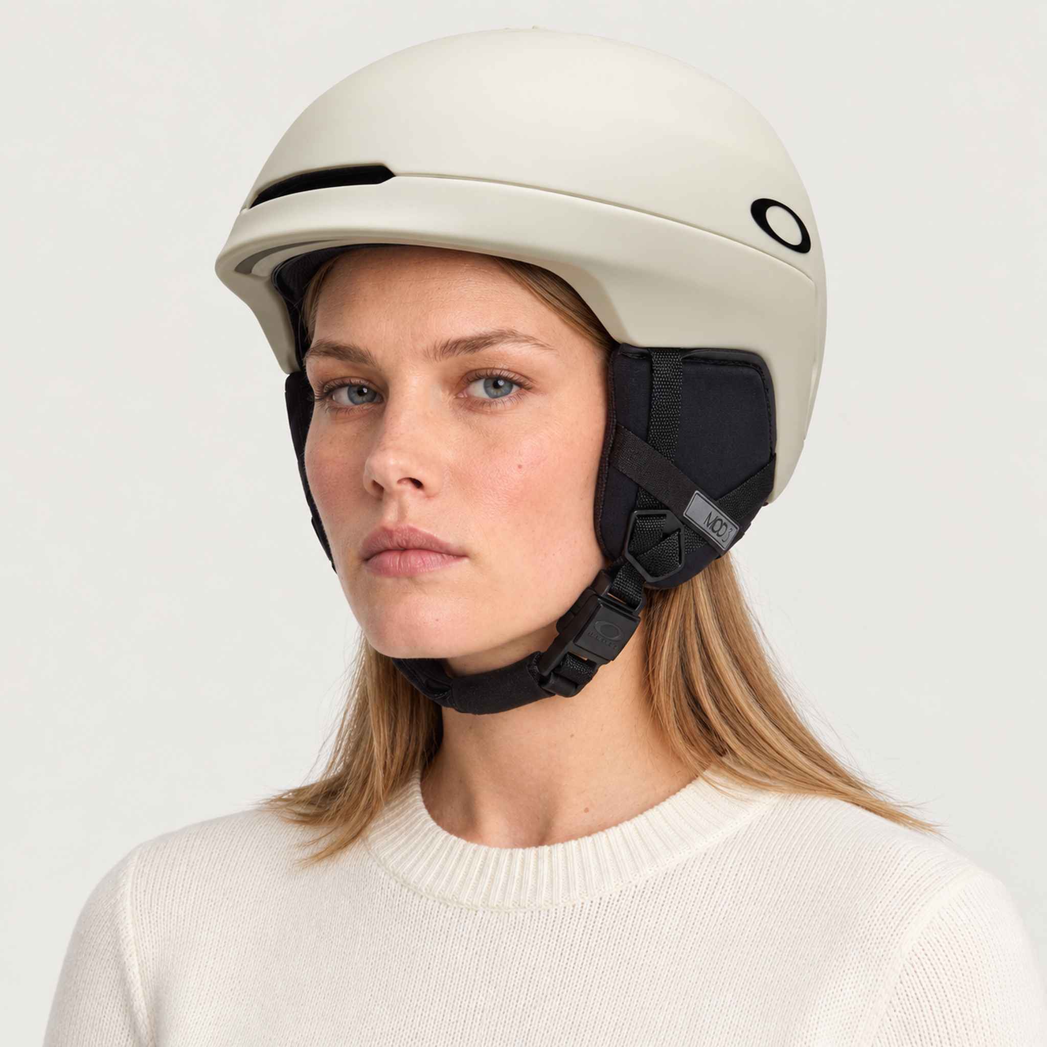 Oakley Mod3 MIPS Helmet in Sand, female model.