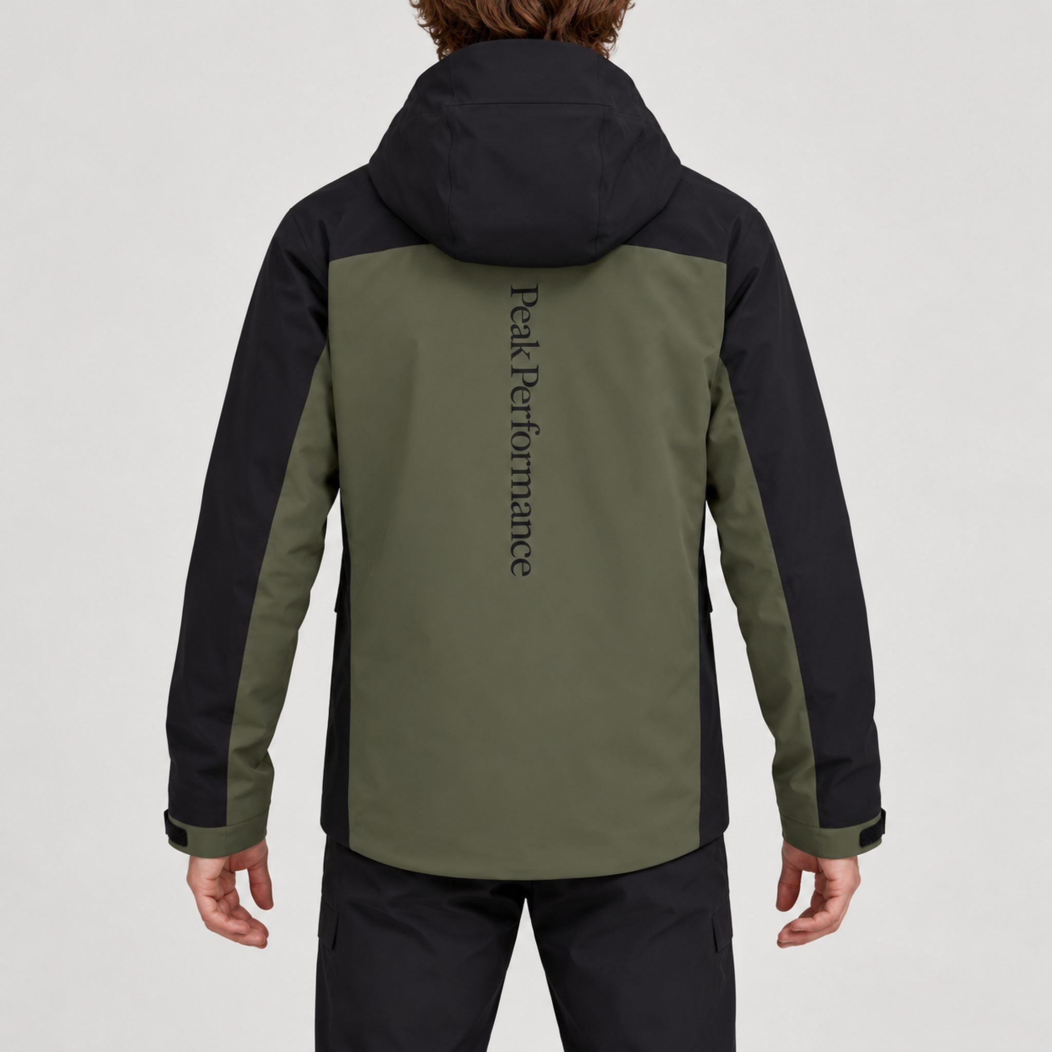 Peak Performance men's Maroon Ski Jacket in Pine Needle/Black – model back