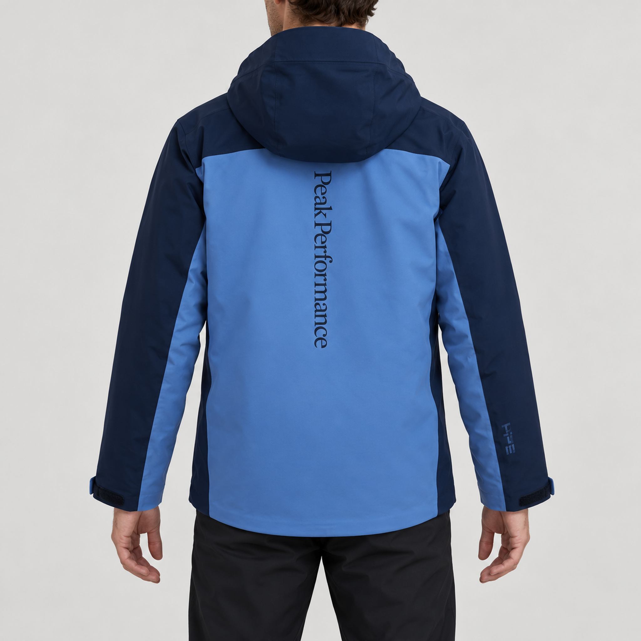Peak Performance men's Maroon Ski Jacket in Summit Sky/Blue Shadow – model back