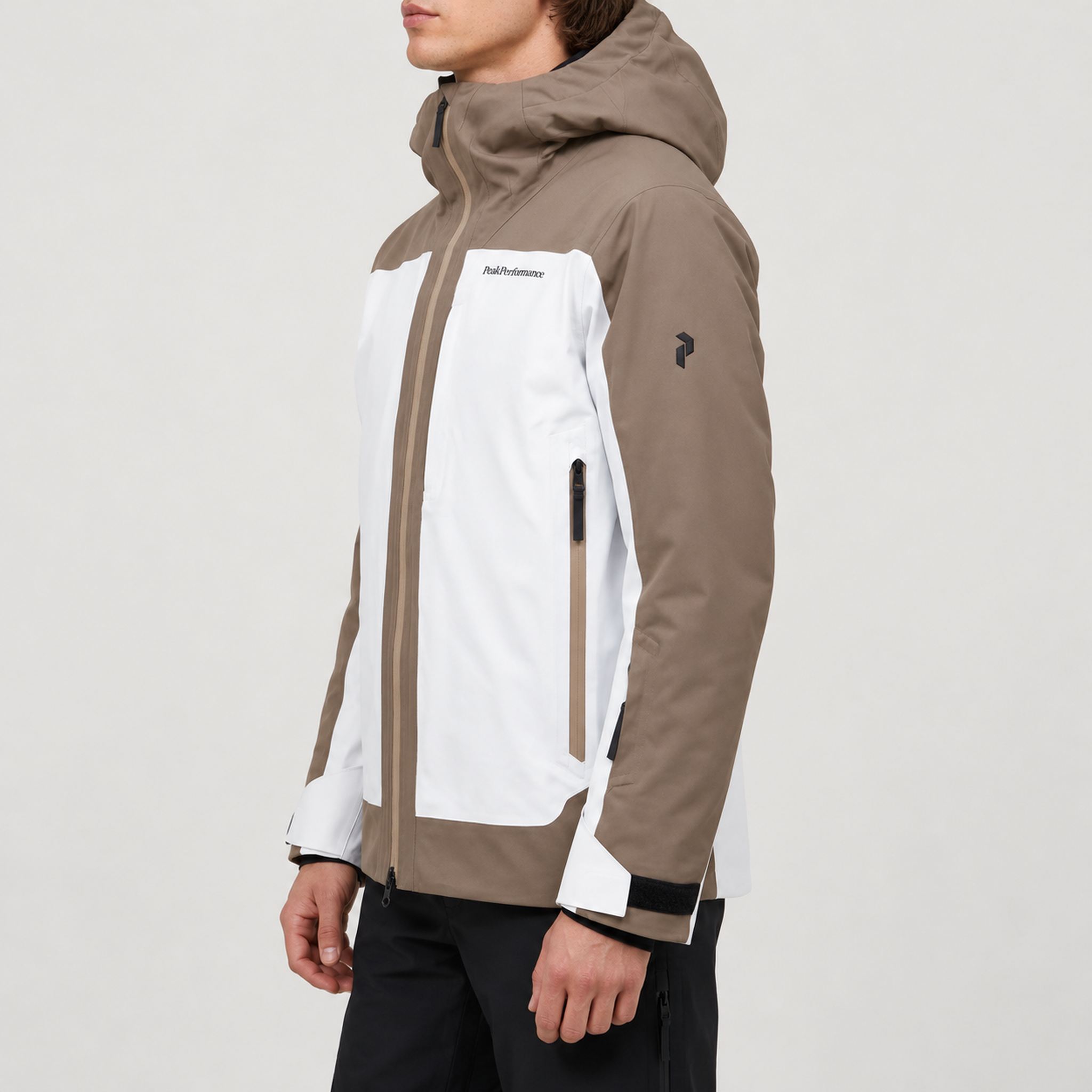 Peak Performance men's Whitelight Ski Jacket in Terrain Tan/Antarctica – model side