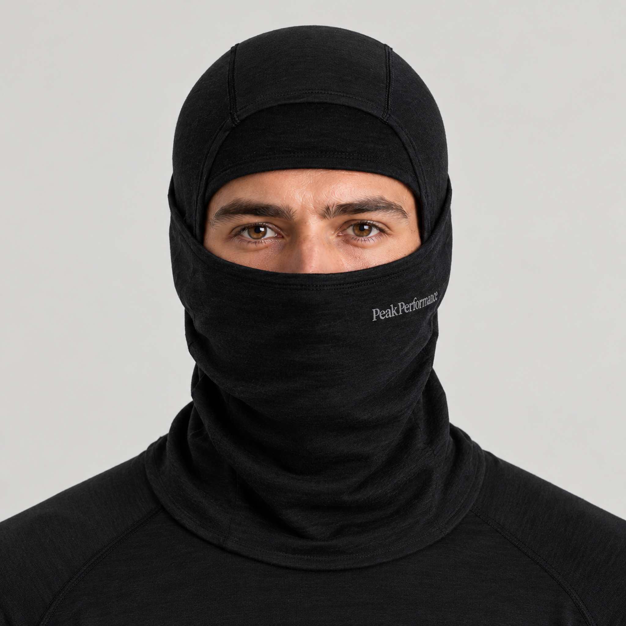 Peak Performance unisex Wool Balaclava in Black – male front