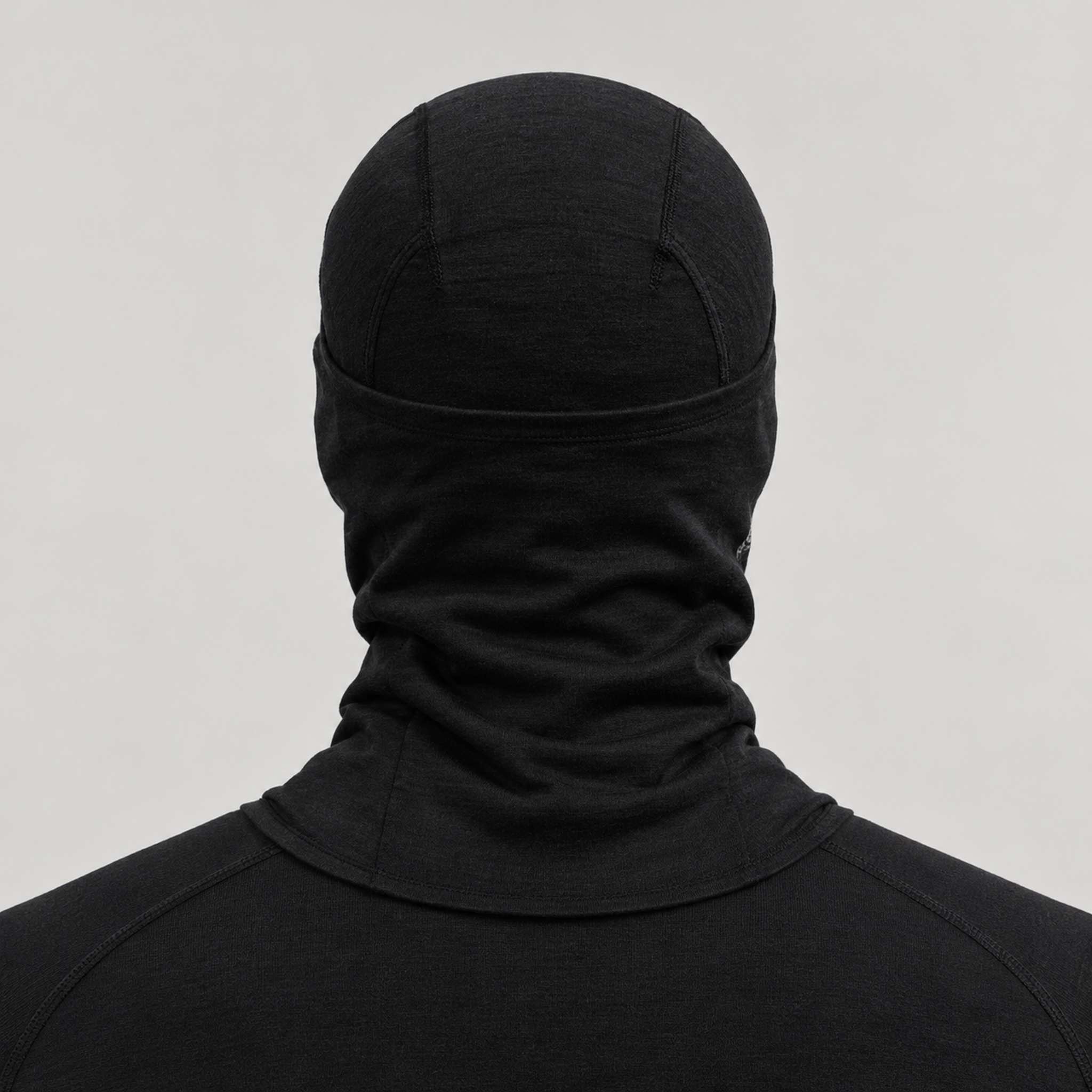 Peak Performance unisex Wool Balaclava in Black – male back