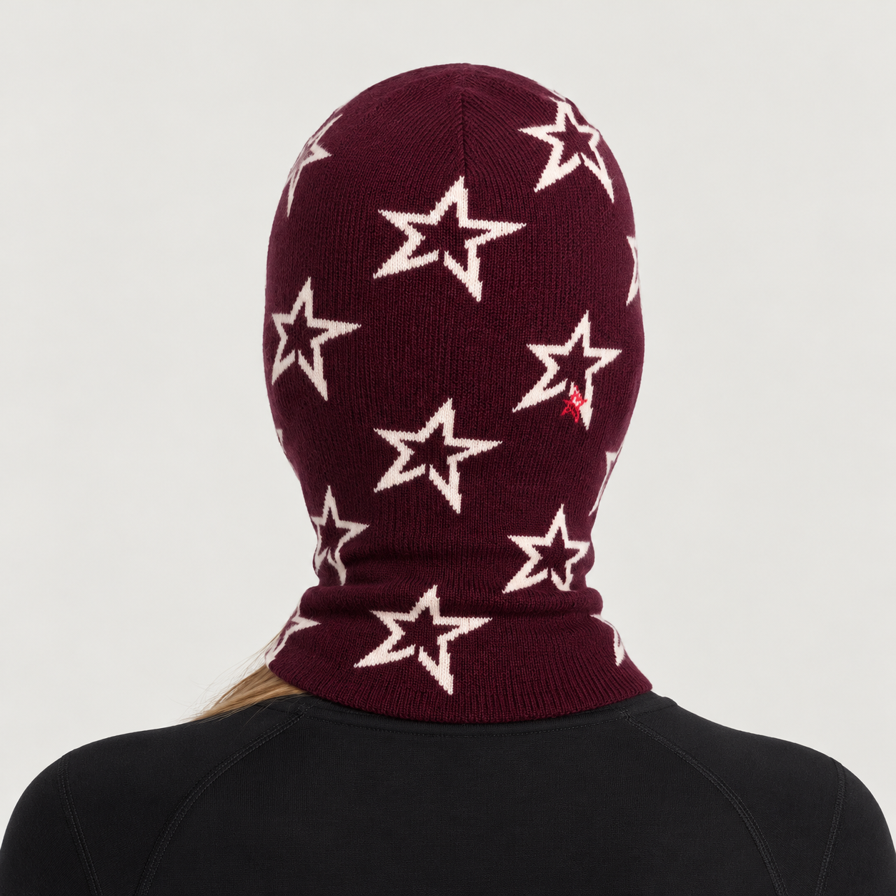 Perfect Moment Balaclava in burgundy with cream stars – woman back view