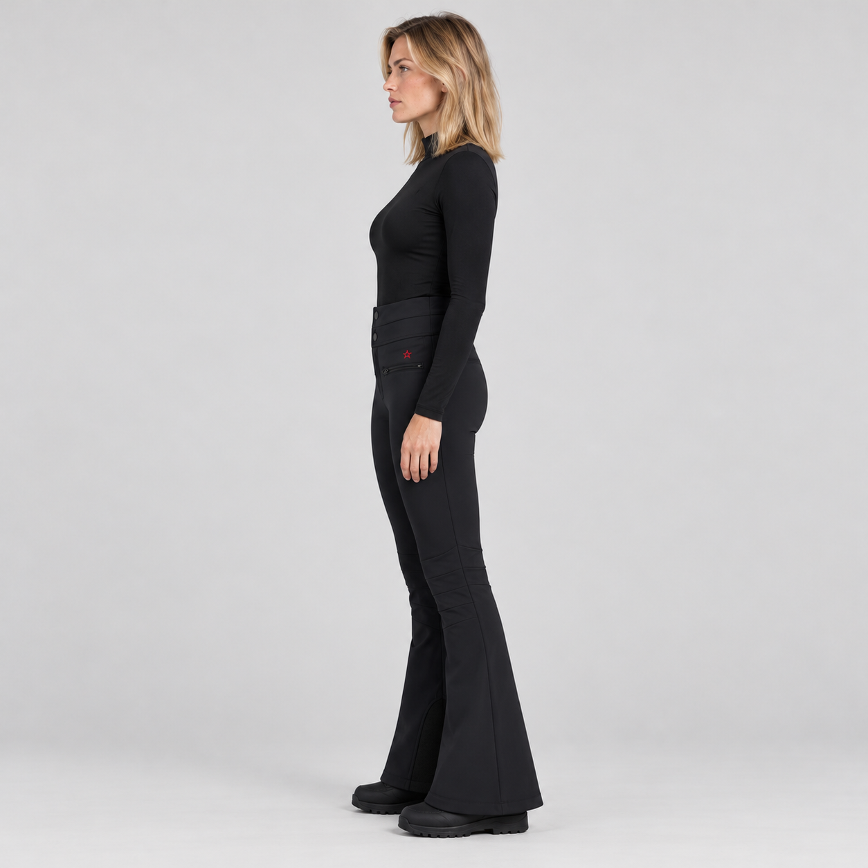 Perfect Moment women’s Aurora High Waist Flare Pant in Black – model side view