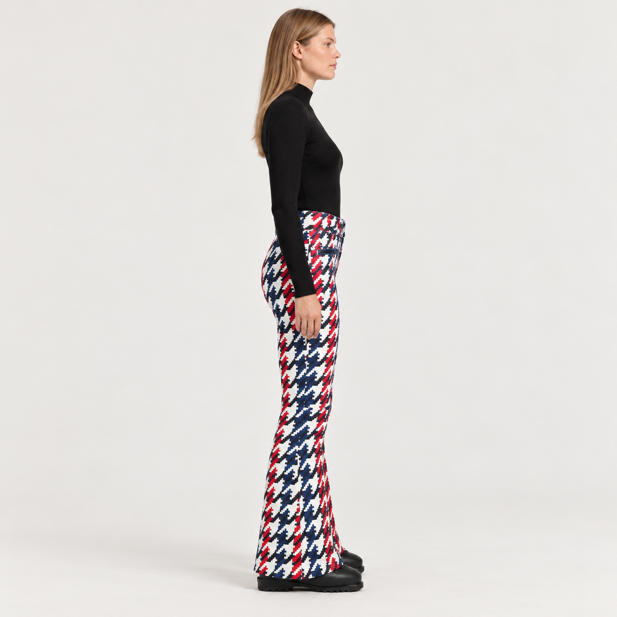 Perfect Moment women’s Aurora High Waist Flare Pant in Houndstooth – model side view