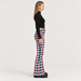 Perfect Moment women’s Aurora High Waist Flare Pant in Houndstooth – model side view