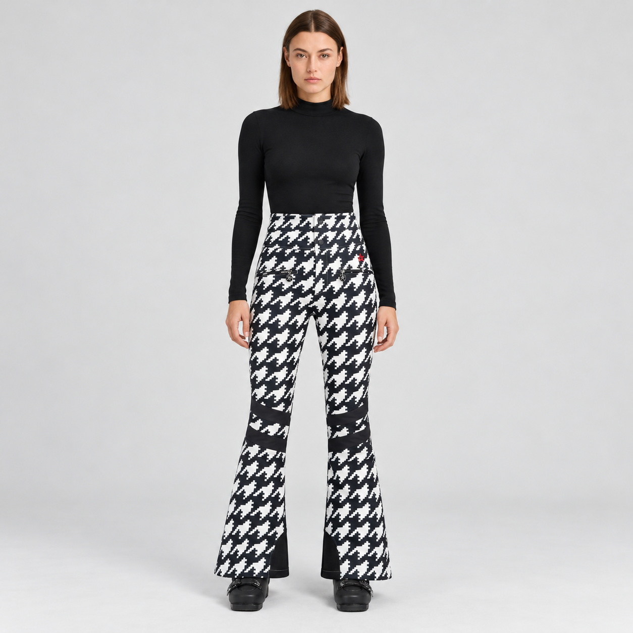 Perfect Moment women’s Aurora High Waist Flare Pant in Houndstooth Black/White – model front view