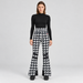 Perfect Moment women’s Aurora High Waist Flare Pant in Houndstooth Black/White – model front view
