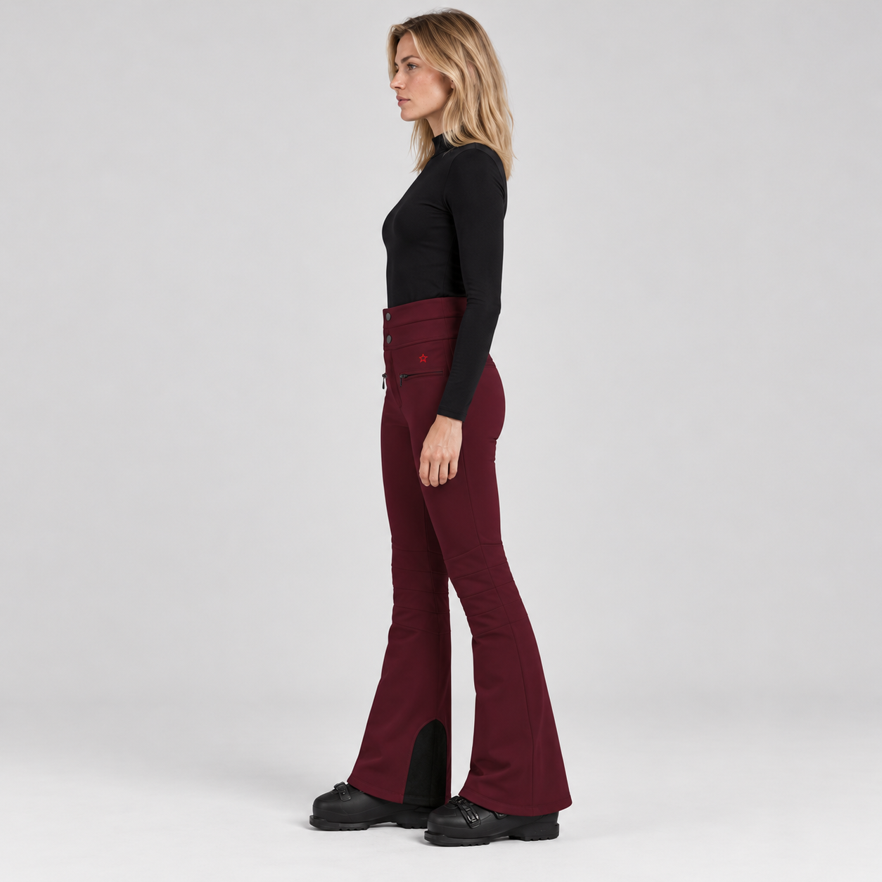 Perfect Moment women’s Aurora High Waist Flare Pant in Wine – model side view
