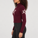 Perfect Moment women’s Cable Sweater in Wine – model side view