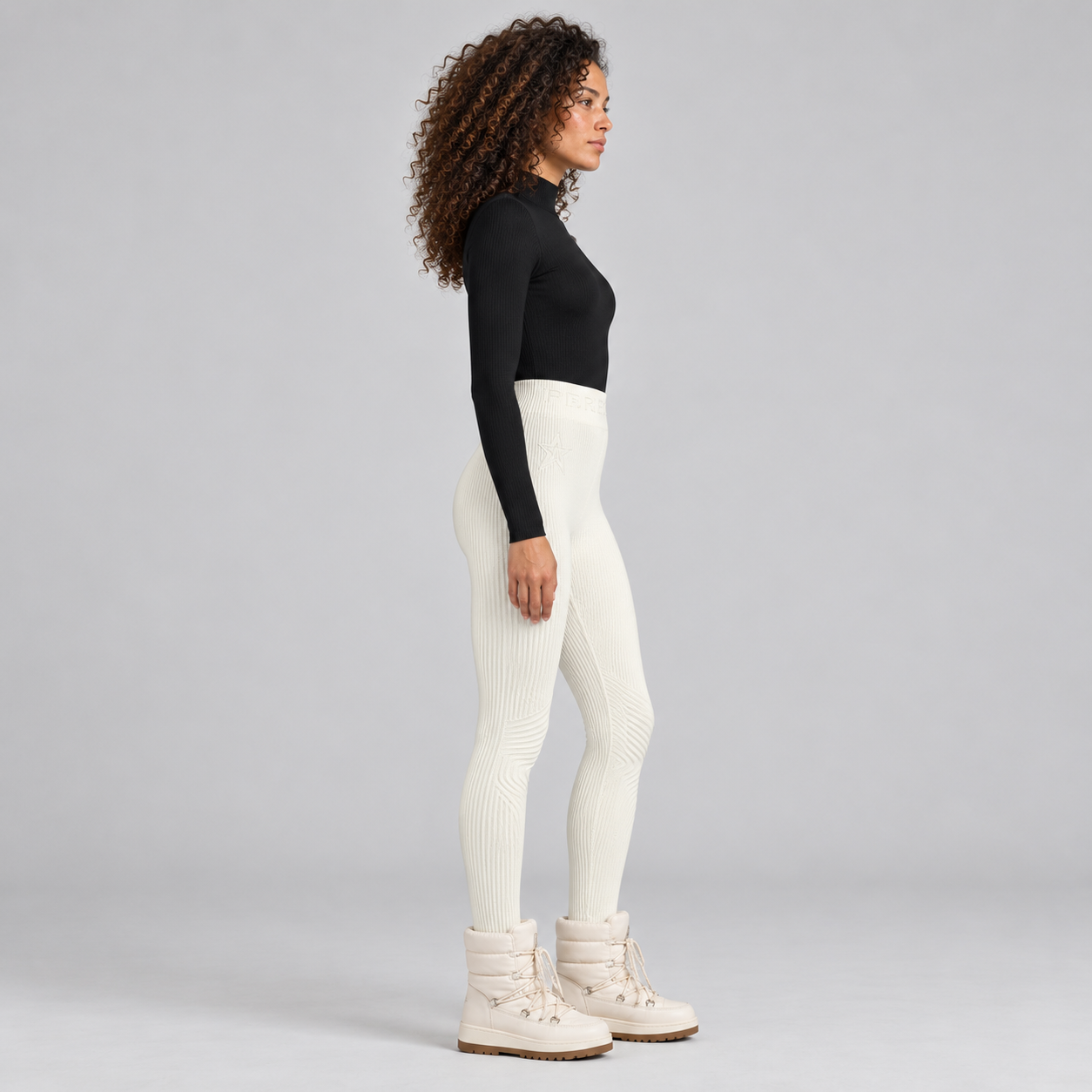Perfect Moment women’s Chalet Baselayer Pant in Snow White – model side view