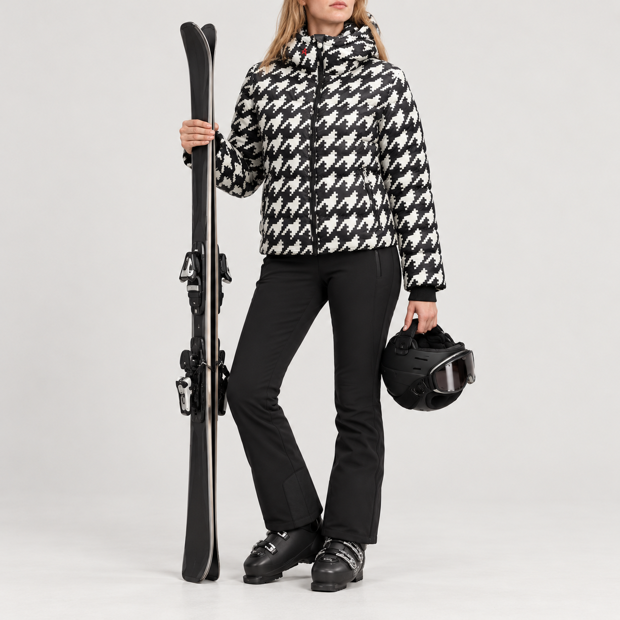 Perfect Moment women’s Polar Flare III Ski Jacket in Houndstooth – model ski props view