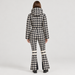 Perfect Moment women’s Polar Flare Ski Suit in Houndstooth – model back view