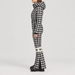Perfect Moment women’s Polar Flare Ski Suit in Houndstooth – model side view