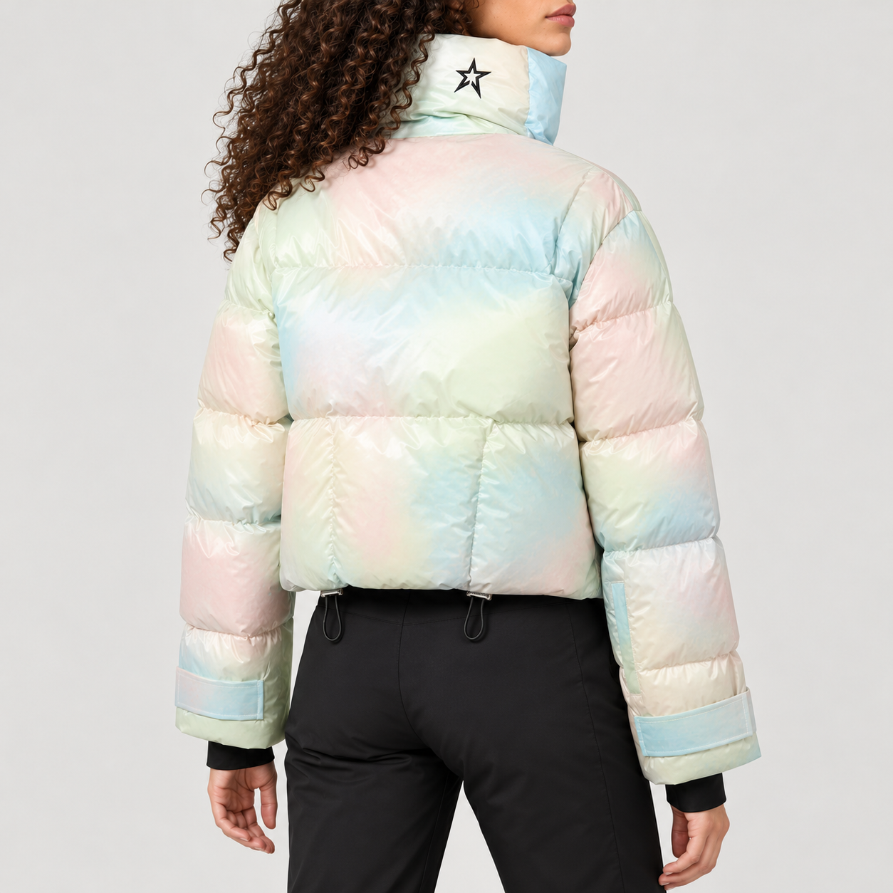 Perfect Moment women’s Astralis Ski Jacket in Pastel Powder – model back view