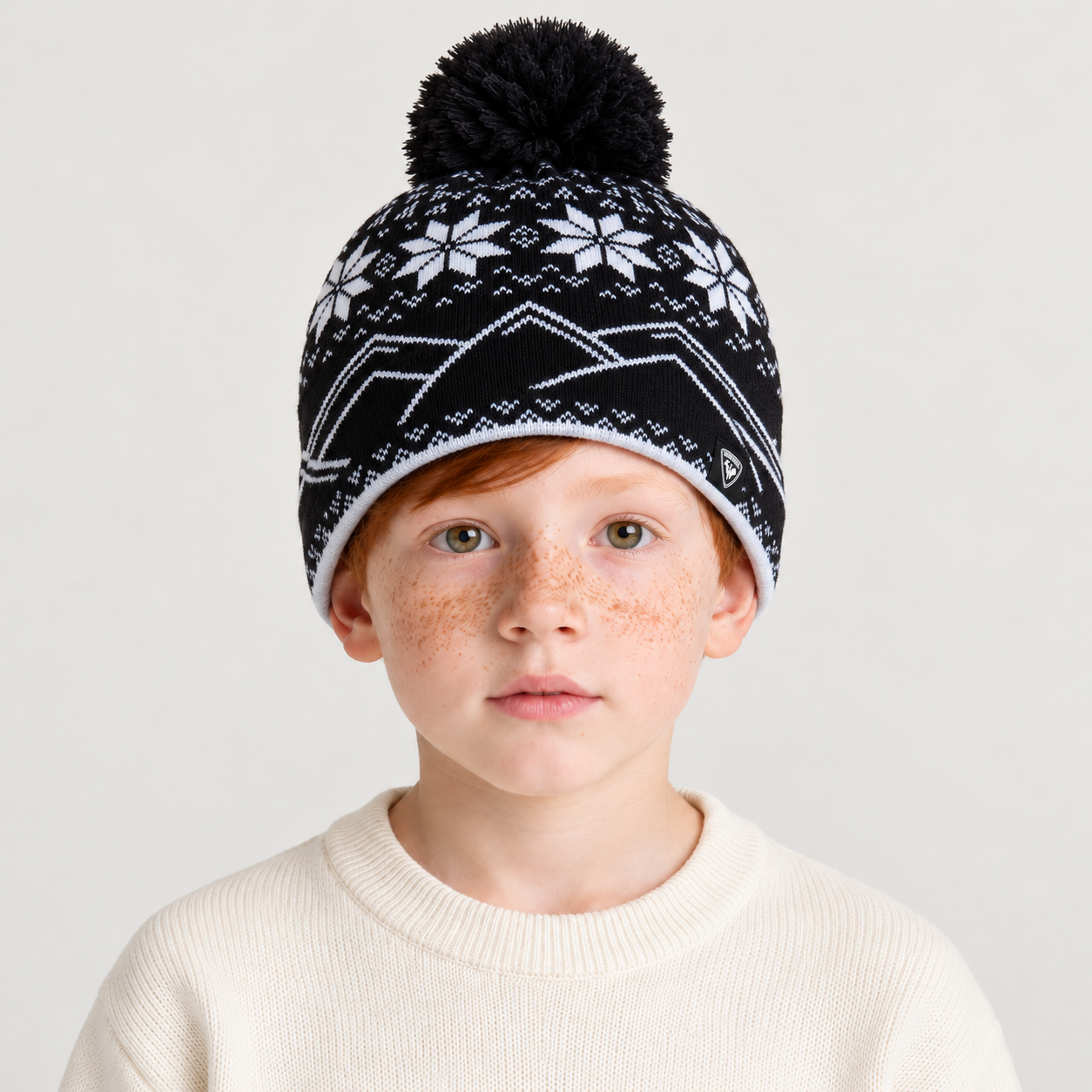 Rossignol Pompon Junior Beanie in BLACK — 03 kids front view
