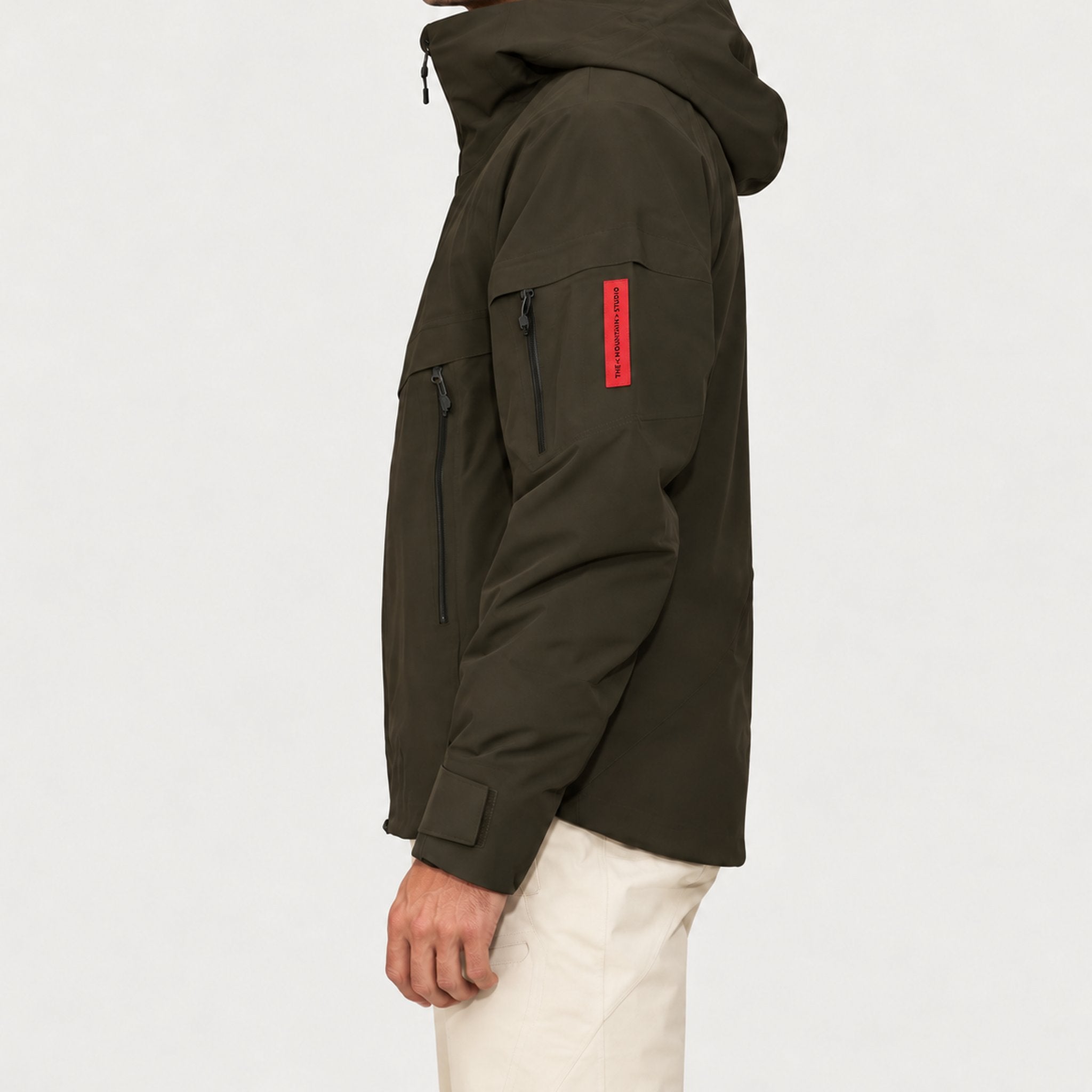 The Mountain Studio Alp Insulated Ski Jacket in Peat Brown — peat brown — model side