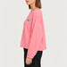 French Disorder women Alpes Patch Sweater in Bubblegum - model side | London Ski Co